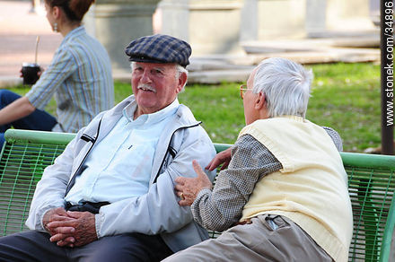 Old men talking in a square - Department of Colonia - URUGUAY. Photo #34896