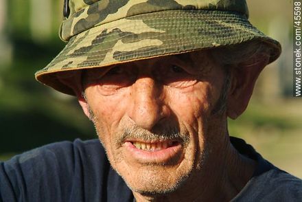 Old man with camouflage cap -  - MORE IMAGES. Photo #45598