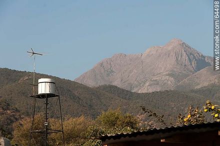Water tank, wind vane and hills - Chile - Others in SOUTH AMERICA. Photo #64498