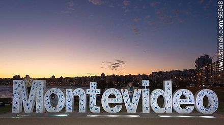 Montevideo in letters painted with footprints at sunset - Department of Montevideo - URUGUAY. Photo #65948