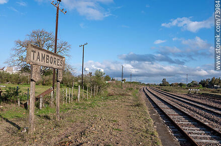 Train station sign and railroad tracks - Department of Paysandú - URUGUAY. Photo #73984