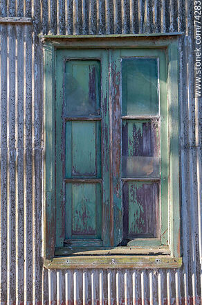 Window shutter in a corrugated sheet metal wall - Department of Cerro Largo - URUGUAY. Photo #74283