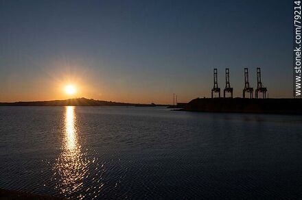 Silhouette of Montevideo Hill against the setting sun and the port cranes - Department of Montevideo - URUGUAY. Photo #79214