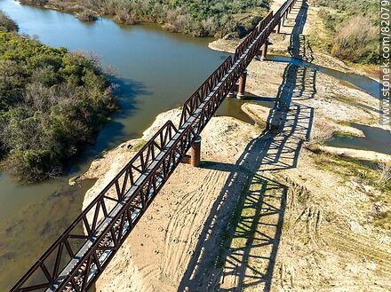 Aerial view of the recycled railroad bridge over the Santa Lucia river, departmental boundary between Canelones and Florida. Drought of 2023 - Department of Florida - URUGUAY. Photo #82079