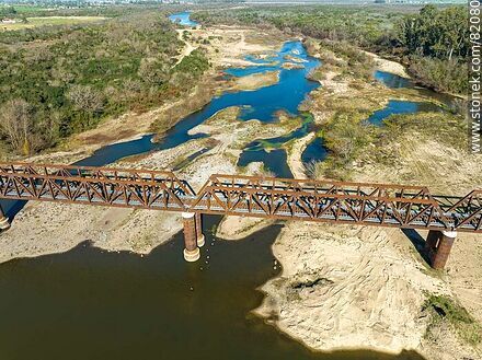 Aerial view of the recycled railroad bridge over the Santa Lucia river, departmental boundary between Canelones and Florida. Drought of 2023 - Department of Florida - URUGUAY. Photo #82080