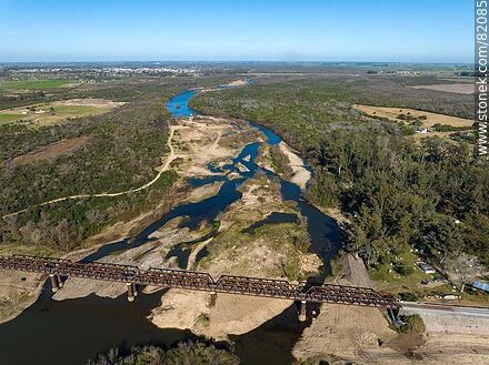 Aerial view of the recycled railroad bridge over the Santa Lucia river, departmental boundary between Canelones and Florida. Drought of 2023 - Department of Florida - URUGUAY. Photo #82085