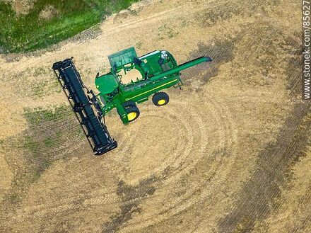 Aerial view of a combine harvester harvesting and threshing barley -  - URUGUAY. Photo #85627