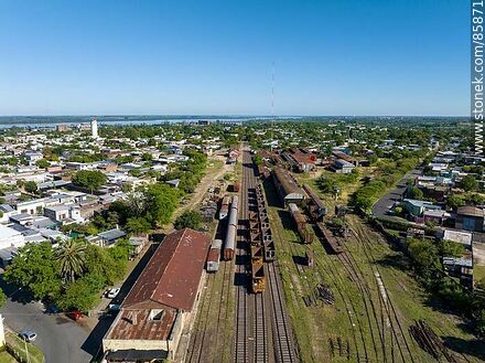 Aerial view of the Paysandú train station and its railroad tracks through the city - Department of Paysandú - URUGUAY. Photo #85871