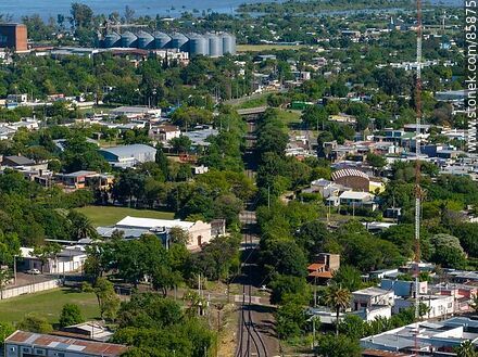 Aerial view of the railroad tracks through the middle of the city - Department of Paysandú - URUGUAY. Photo #85875
