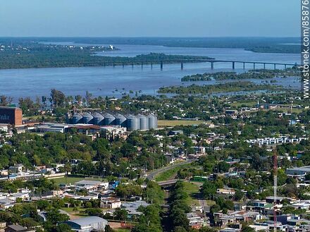 Aerial view of the city of Paysandú and the Gral. Artigas Bridge. - Department of Paysandú - URUGUAY. Photo #85876