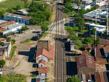 Aerial view of the Paysandú train station and its railroad tracks through the city - Department of Paysandú - URUGUAY. Photo #85877