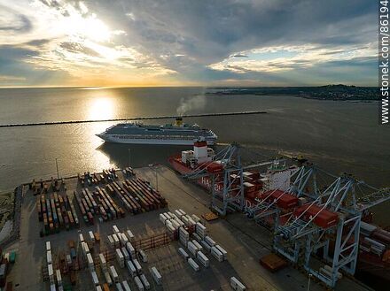 Aerial view of the sunset with a cruise ship leaving the port in front of the container terminal. - Department of Montevideo - URUGUAY. Photo #86194